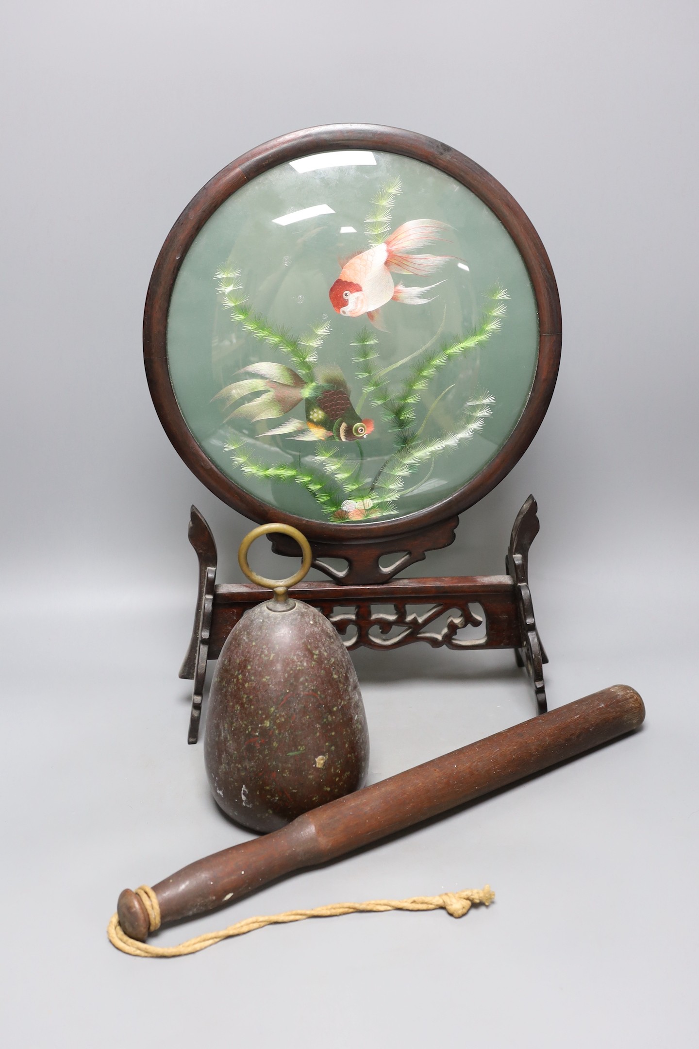 A Serpentine door-stop, Chinese table screen and a Victorian truncheon, Chinese table screen 46.5 cms high.